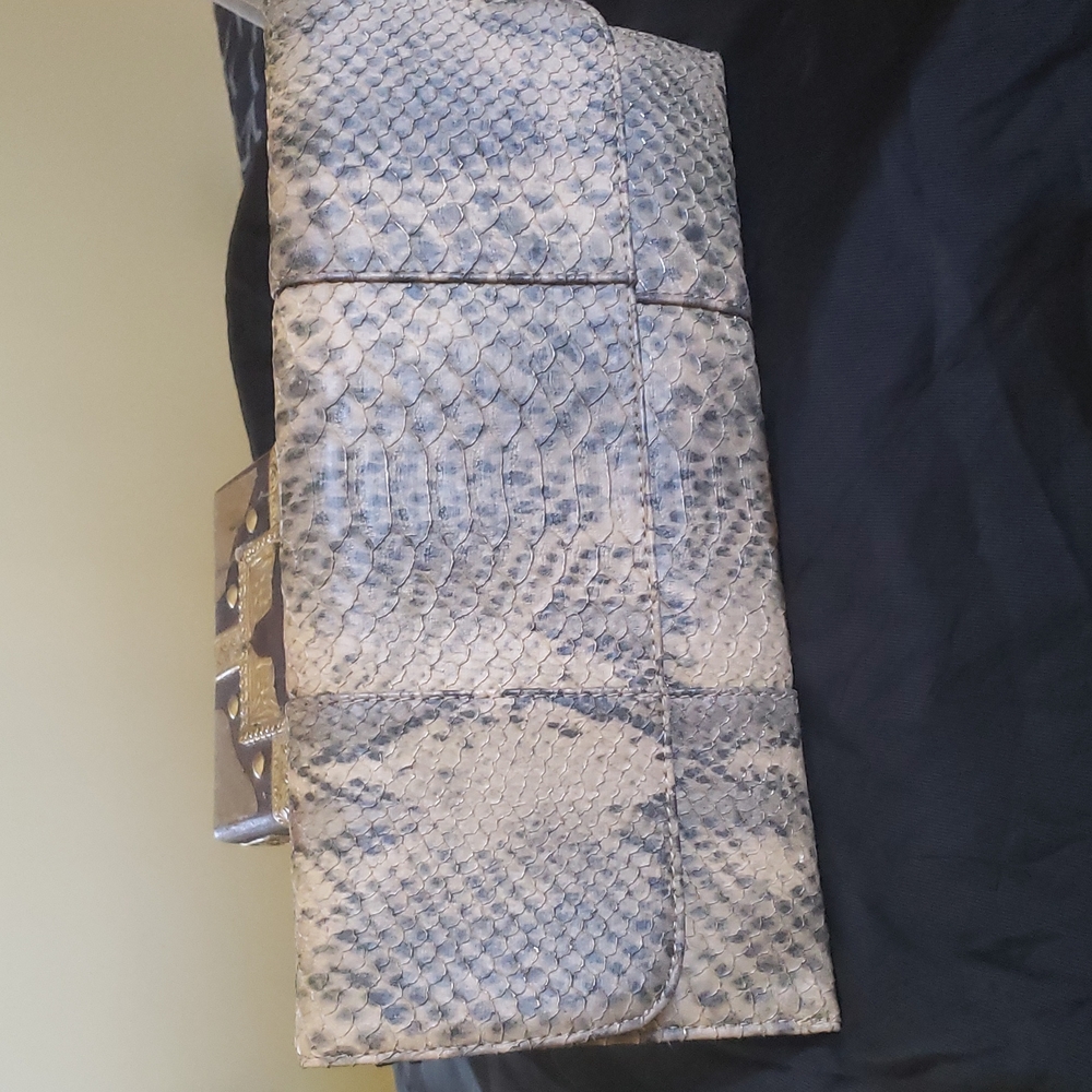 Snakeskin clutch.